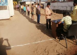 Masks & sanitisation items being distributed to construction workers at Sabarmati Passenger hub construction site