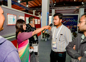 Participants engage in an interactive quiz game at the NHSRCL stall during the Vibrant Gujarat 2024_3