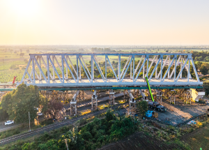 130 m span of a 230 m long  steel bridge launched over NH-64 & Indian Railway tracks for Bullet Train Project