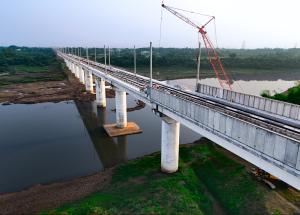 Installation of OHE masts and noise barriers at Purna river, Navsari district for Mumbai–Ahmedabad Bullet Train corridor
